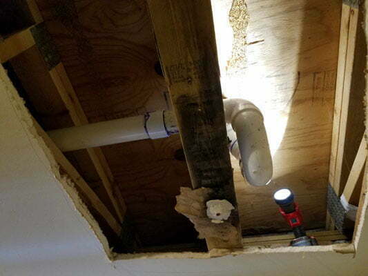 Pipes visible below a floor